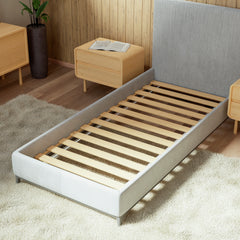 Bed slats KUUSK being showcased in cozy bedroom on a textile bed