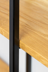 Close up view of solid wood floating shelf ÄIKE highlighting the black metal frame and solid wood grain