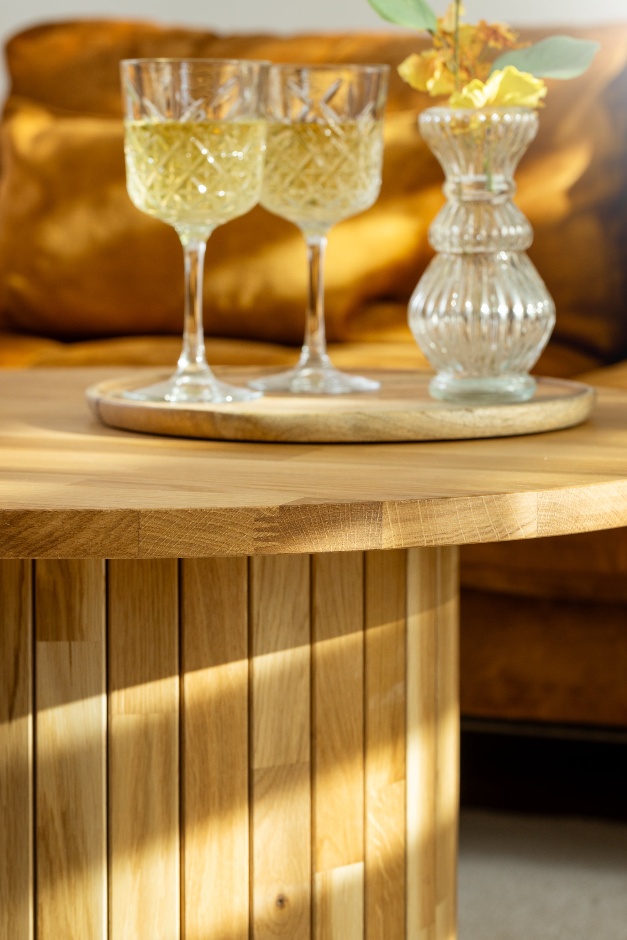 KALDA coffee table elegantly displaying two wine glasses