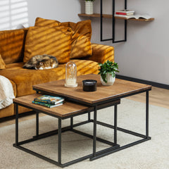 The Nurmenukk coffee table styled with books, a flower and a candle for a cozy living room setting