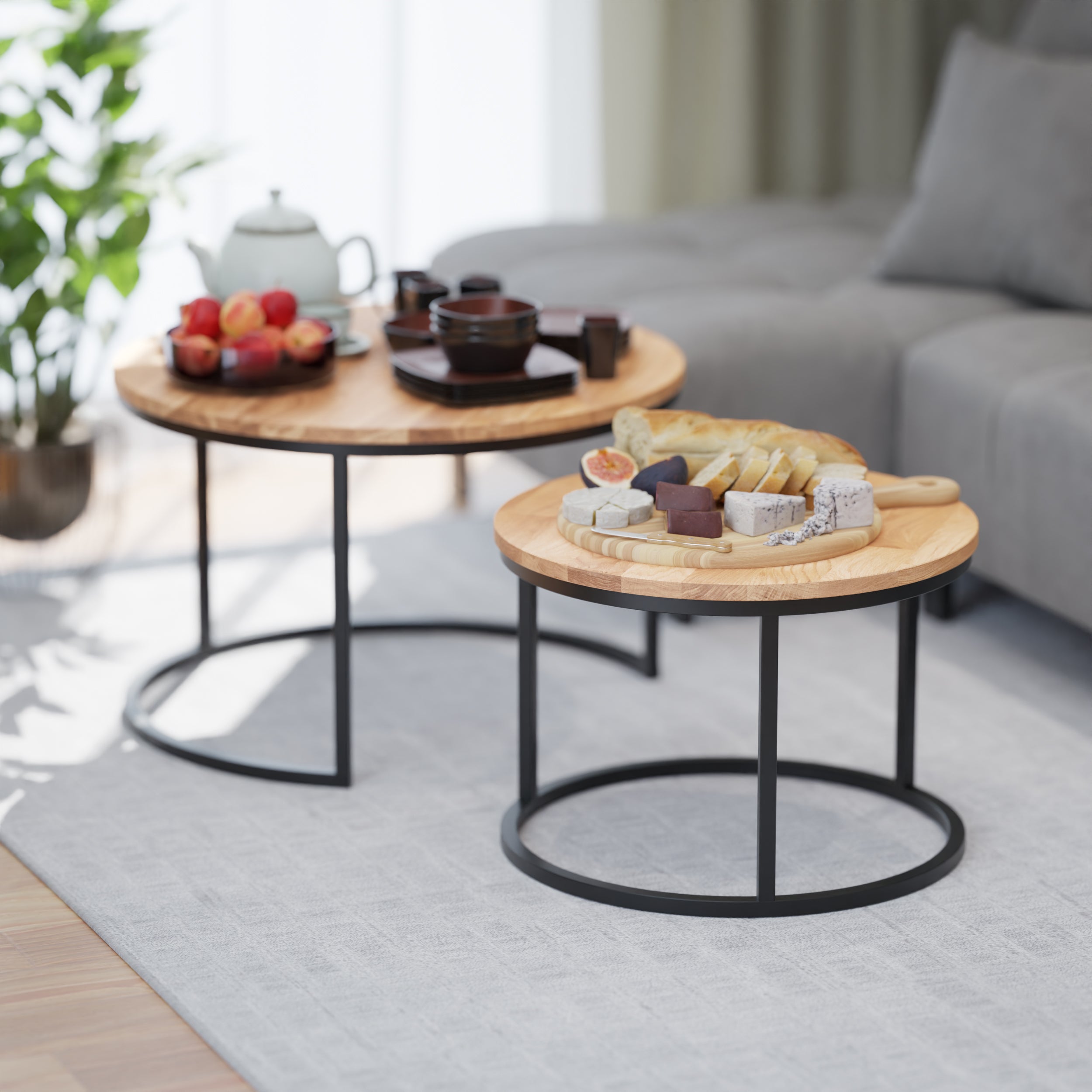 The Rukilill coffee table set styled with books, a flower and coffee mugs for a cozy living room setting