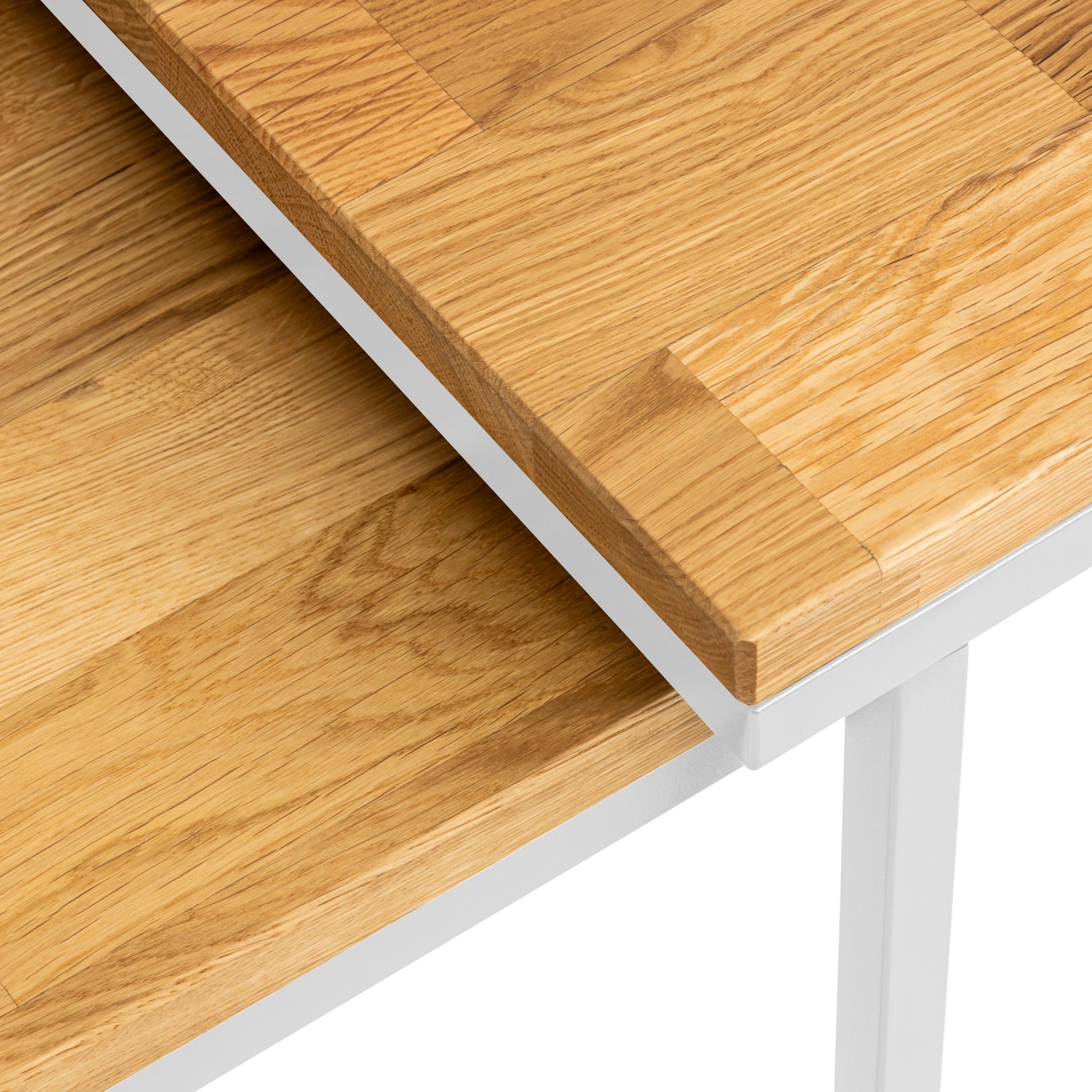 Detailed shot of the Nurmenukk coffee table highlighting its metal legs and wooden tabletop