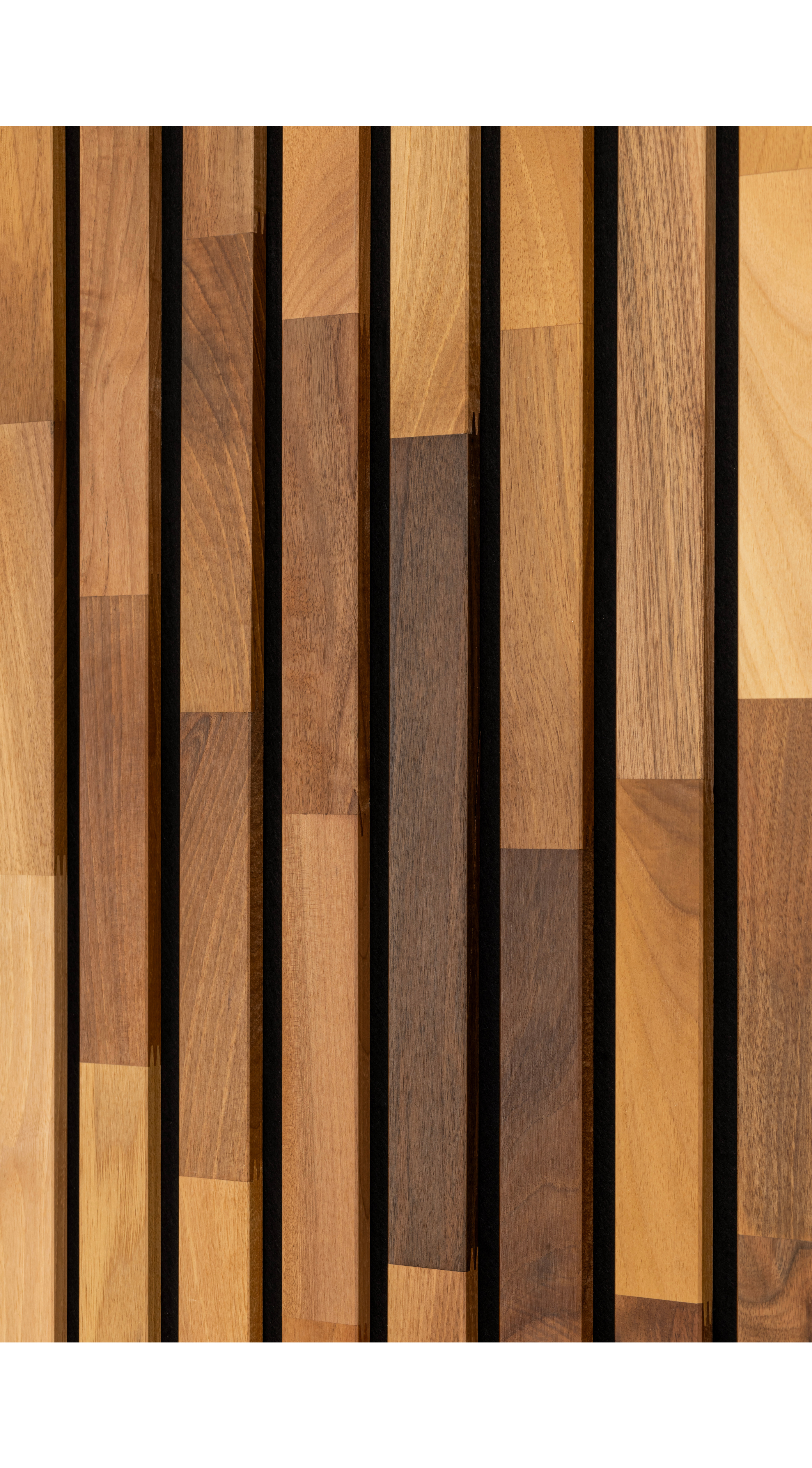 A close up shot of dark Solid Wood Acoustic Wall Panels featuring the natural pattern of the slats