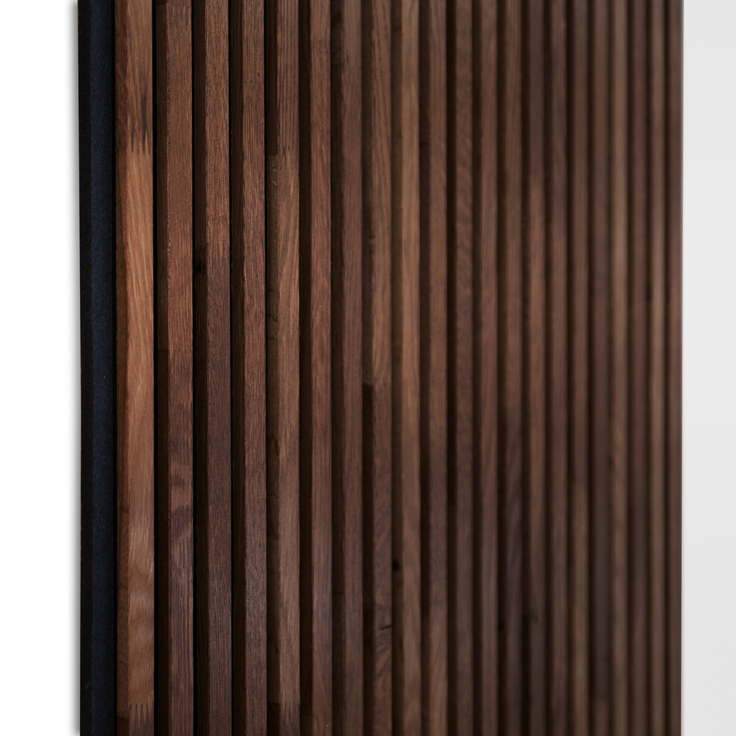 A close up shot of dark Solid Wood Acoustic Wall Panels