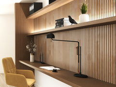 Natural oak Solid Wood Acoustic Wall Panels in a cozy home office setting with books on the shelves and a yellow chair