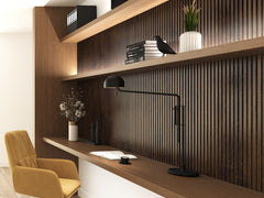 Chocolate brown Solid Wood Acoustic Wall Panels in a cozy home office setting with books on the shelves and a yellow chair