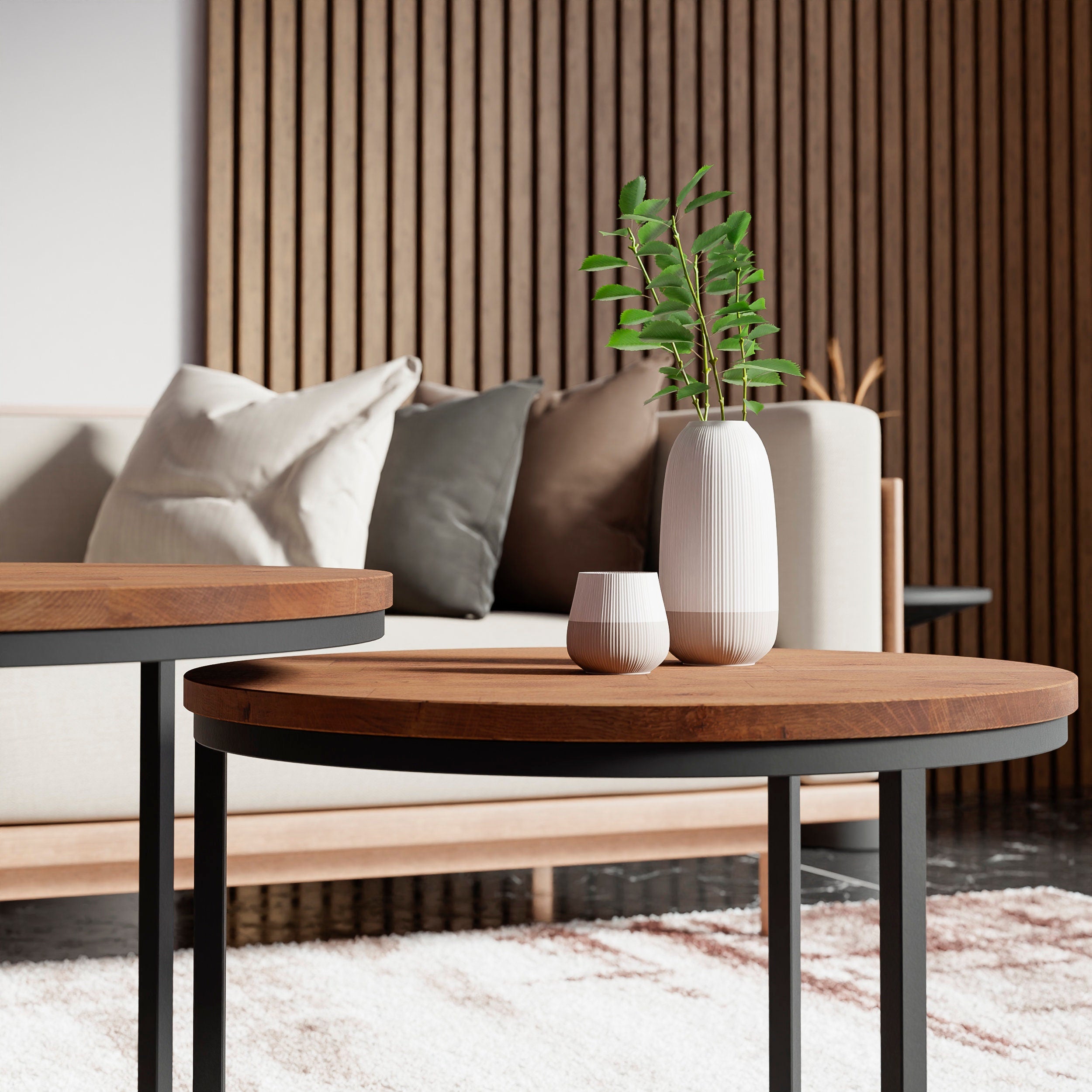 A close-up shot of the coffee table Rukilill highlighting its black metal legs and dark oak tabletop. 