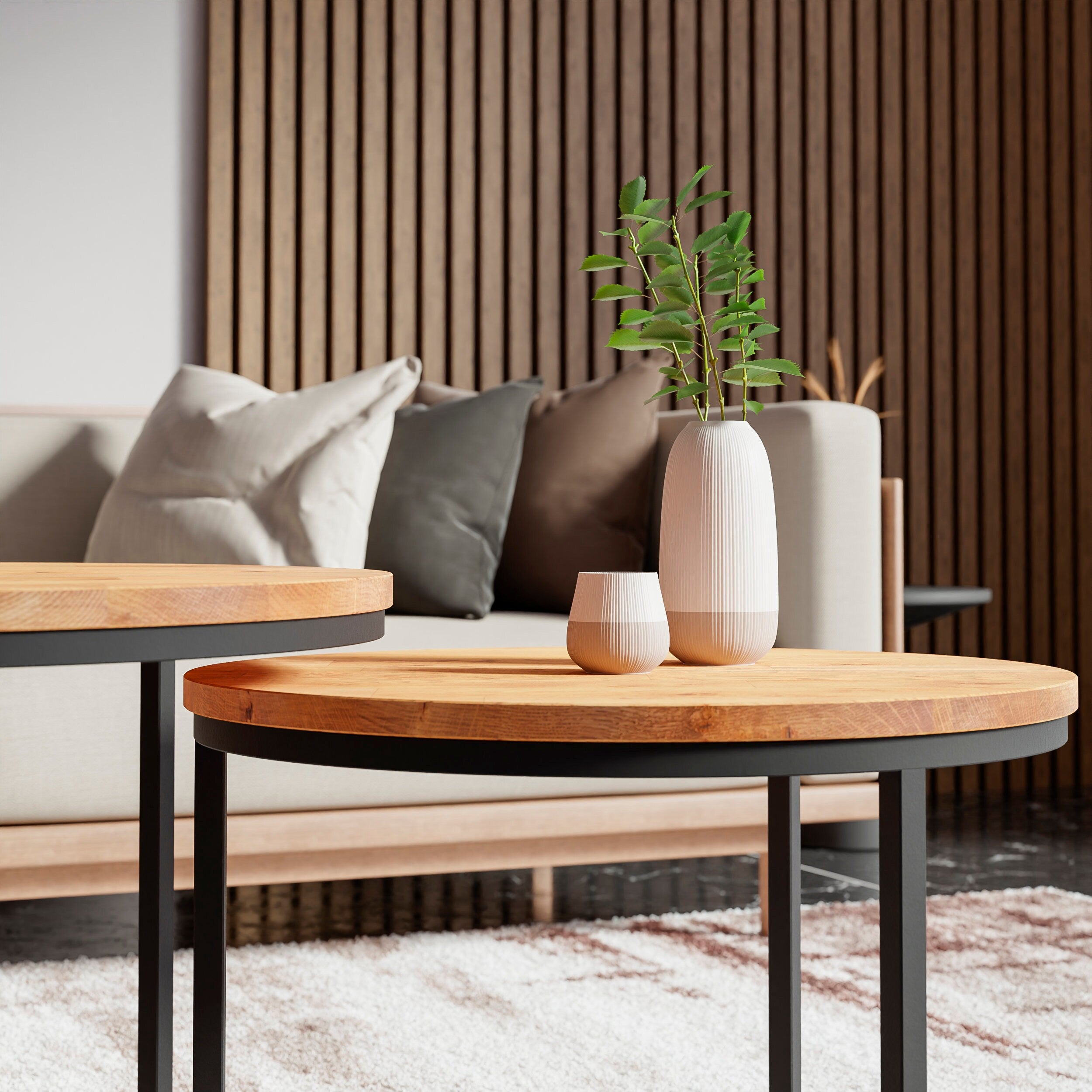 A close-up shot of the coffee table Rukilill highlighting its black metal legs and natural oak tabletop