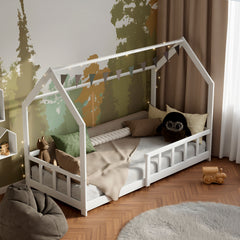 White solid wood Montessori House bed with barriers in a modern kid bedroom decorated with pillows, toys and fairy lights