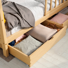 Close up view of the ÖÖBIK natural housebed showing the drawers opened