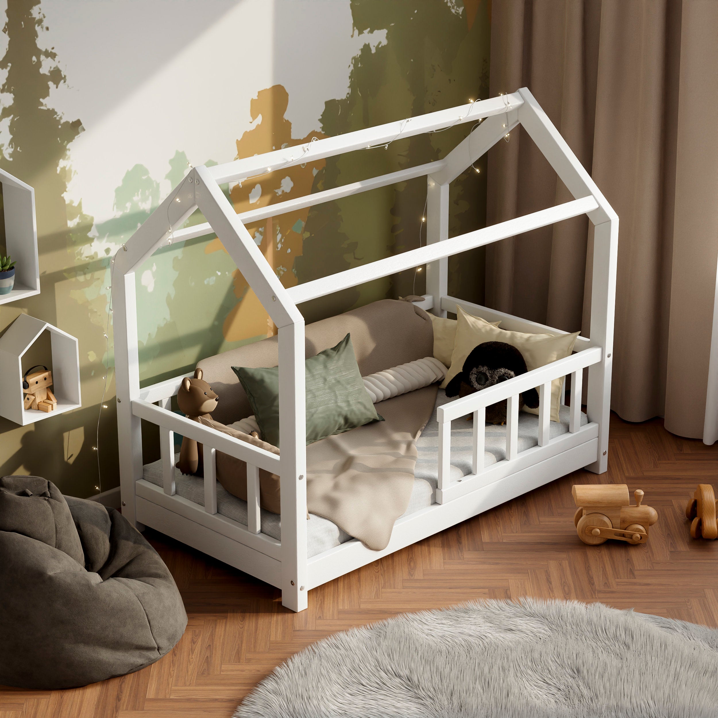 White wooden housebed ÖÖBIK in a modern kids room decorated with pillows and toys